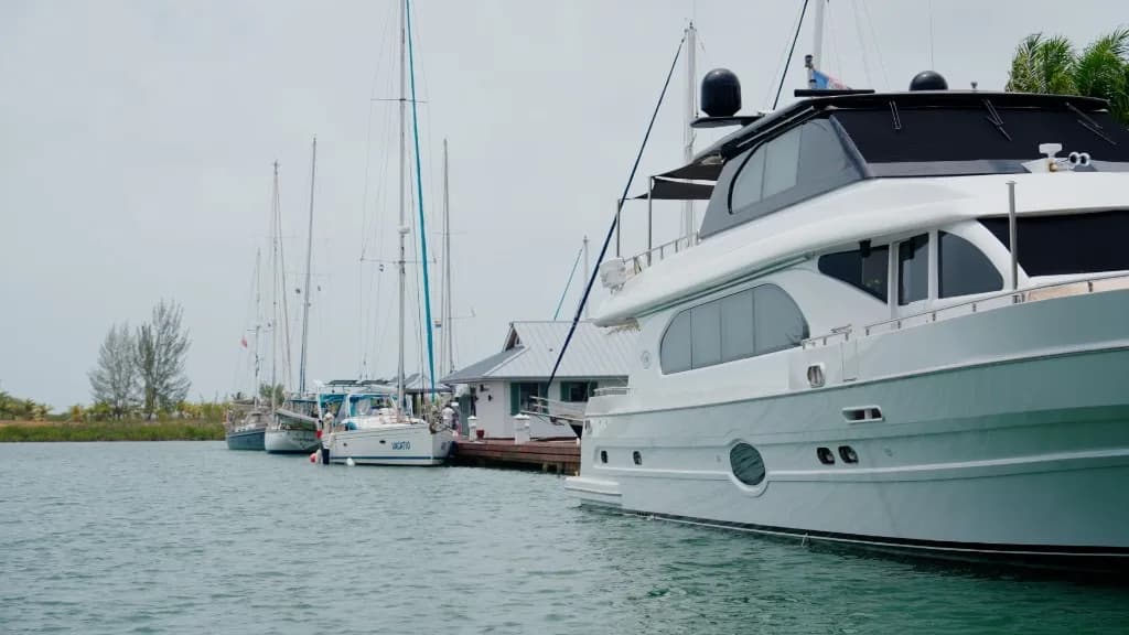 Motor yacht and sailboats along the Red Rock Marina dock